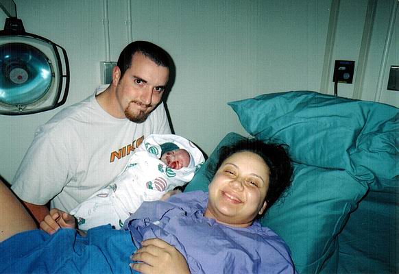 A happy Mom and Dad with a new baby boy.